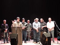 Lynn Meredith thanking their great crew! Present on stage along with the band were long time band techs, Rob Gibson (behind Lynn) and David Henry (center).