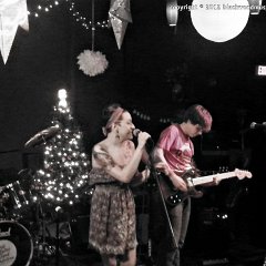 Renelle Aytes (left) also from Chris Aytes &#38; The Good Ambition on drums, Ellie Smith (center) on vocals sings &#34;Merry Christmas Baby&#34;